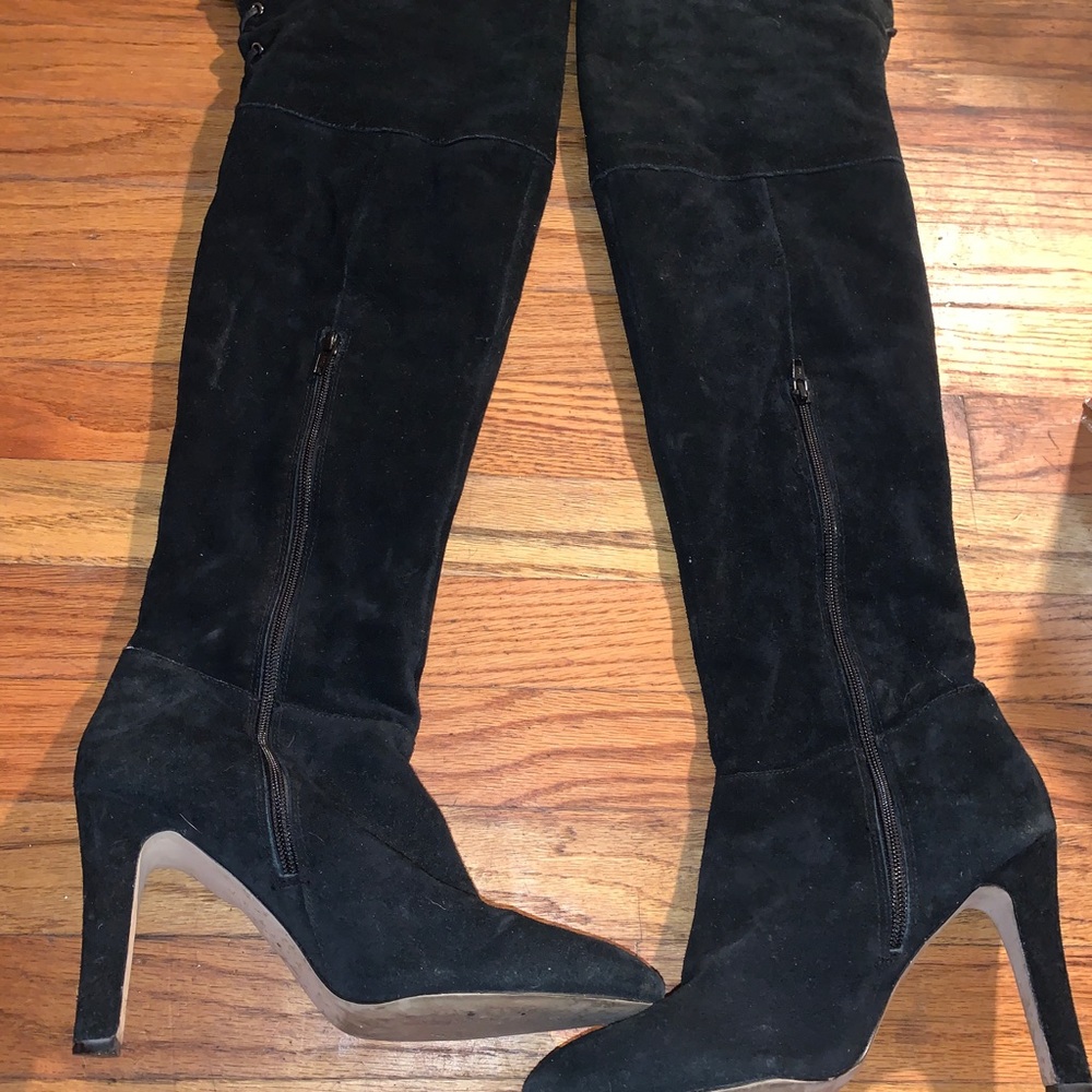 Tall black boots.